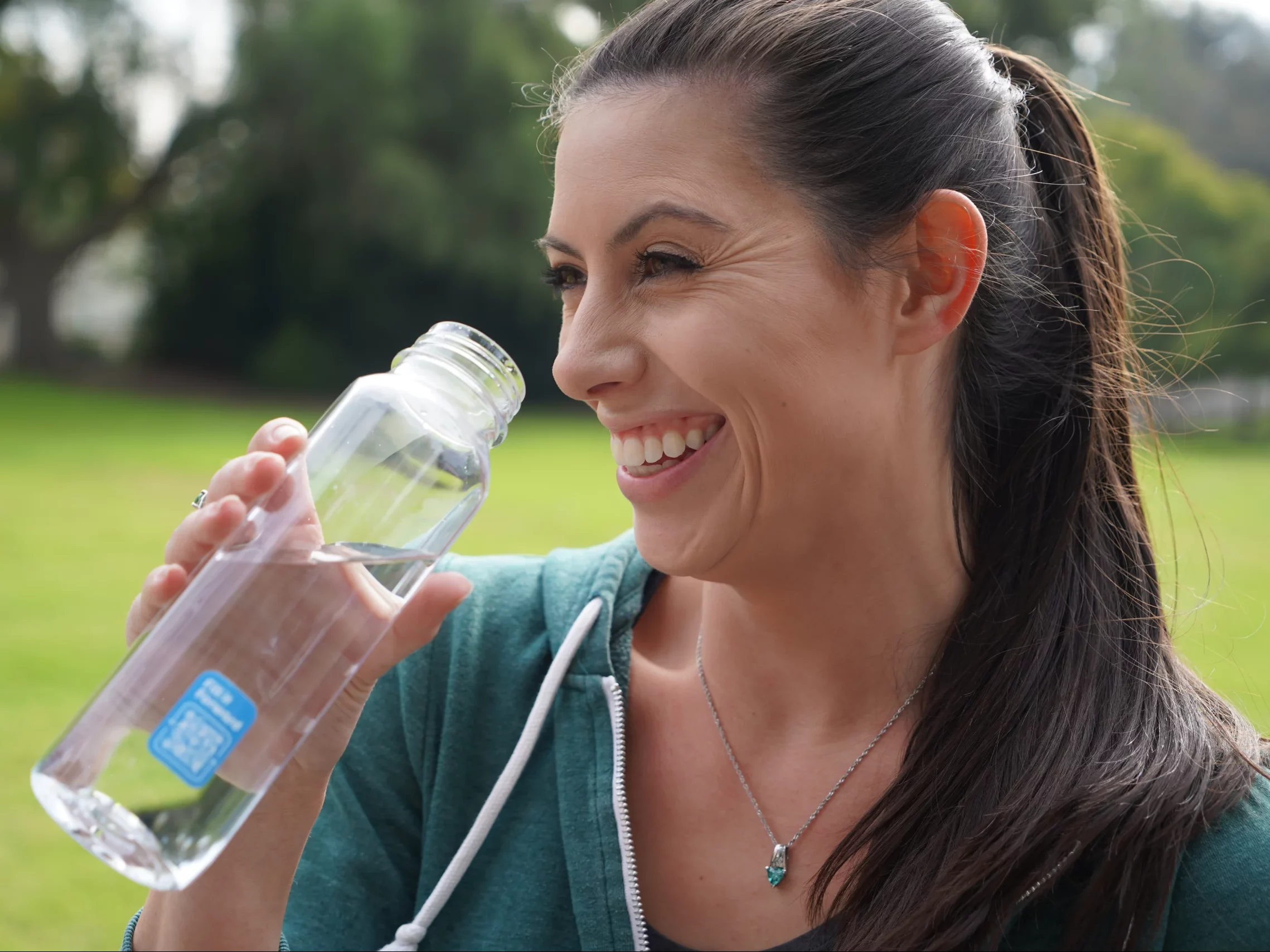 Women drinking from a Cupanion bottle