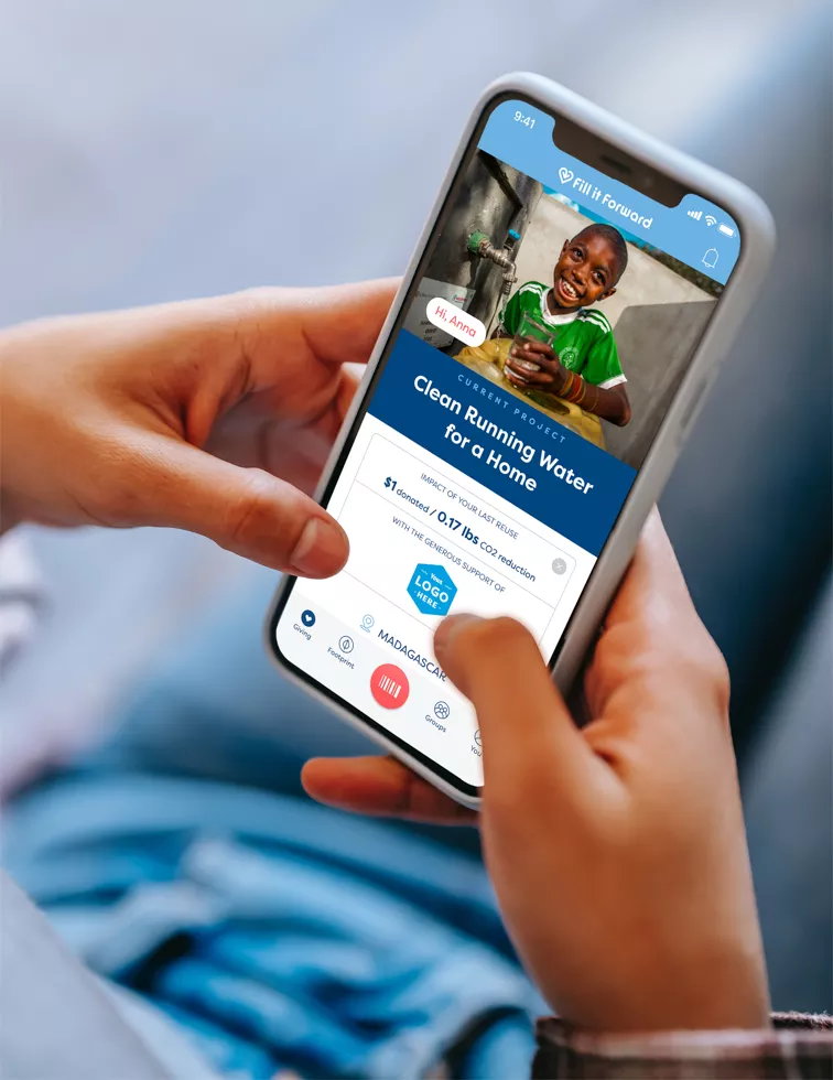 An individual using the Fill it Forward app on their phone.
