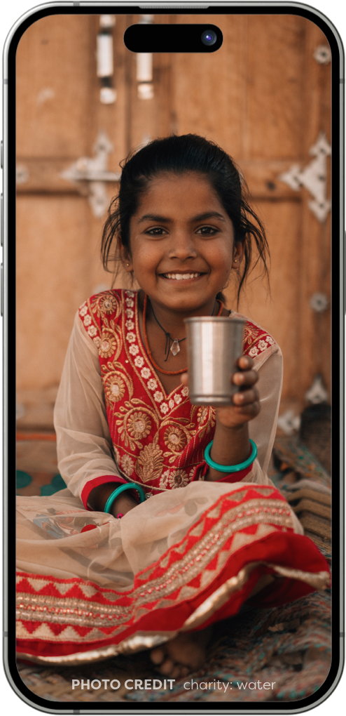 Phone screen of a young girl holding a metal cup