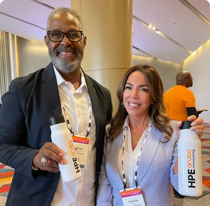 Man and Women holding Cupanion water bottle with HPE logo