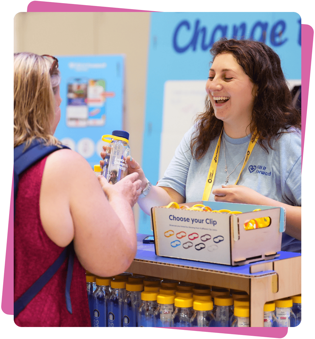Woman handing out cupanion bottle at trade show